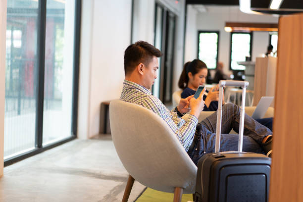 istock People waiting in a business lounge. 1159766317