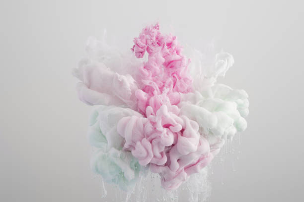 istock Close up view of blue, white and pink paint splash isolated on grey 1159766430