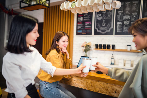 istock Female friends toasting in a cafe 1159767140