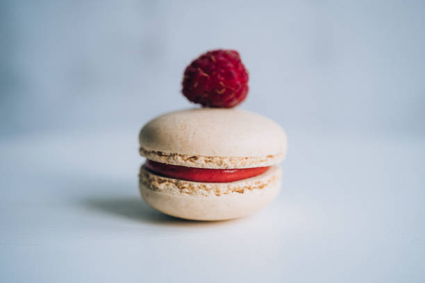 istock Tasty sweet raspberry macaron. One piece 1159768315