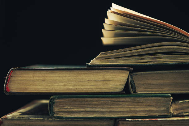 istock Close up Old books on a black background. 1159769947
