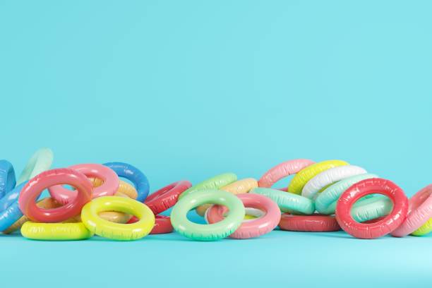 istock Colorful Swim ring drop on blue pastel background. Minimal Summer idea concept. 1159770233