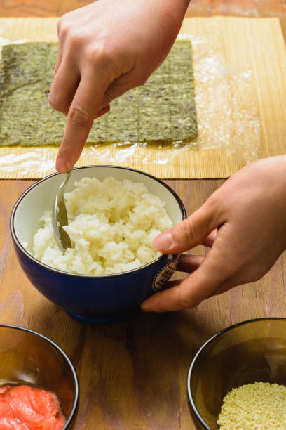 istock The process of preparing sushi from rice and additional ingredients at home 1159770658
