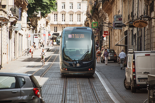 Bordeaux, France. 26 June, 2019: A modern tram in one street of the city centre of Bordeaux, France.