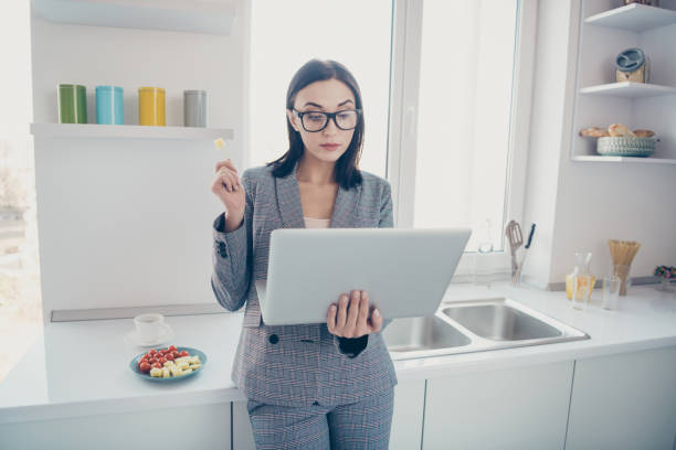 istock Portrait pensive gorgeous boss busy overworked hold hand device report presentation analyze trend stylish beautiful strict leadership stick tomato cheese eyewear eyeglasses formalwear jacket apartment 1159774089