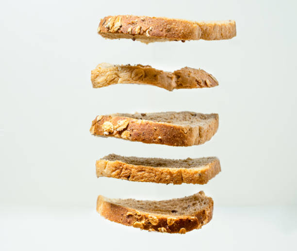 istock Slice fresh toast on the air with white background closup 1159774341