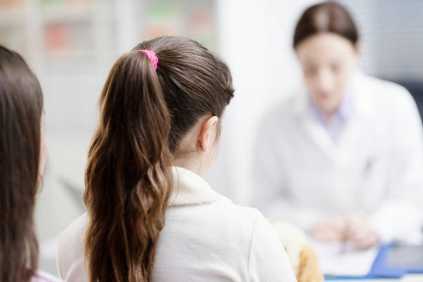 istock Doctor meeting patients in the office 1159775210