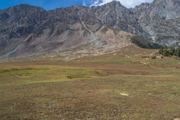 istock Snow capped high mountains alpine meadows and local mountain settlements 1159775274