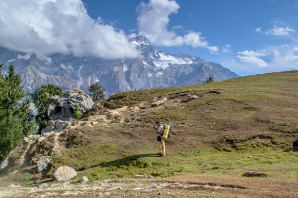 istock Snow capped high mountains alpine meadows and local mountain settlements 1159775319