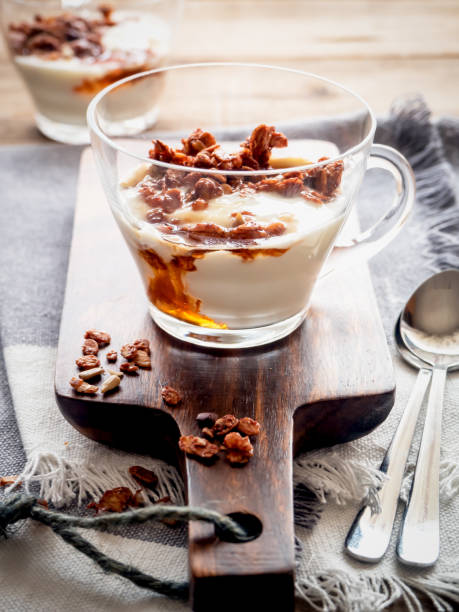 istock Yogurt with granola and honey in a glass 1159776785