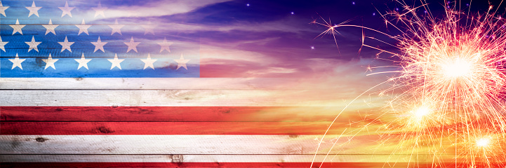 Vintage Wooden American Flag Fading Into Sunset Sky With Sparklers - Independence Day Concept