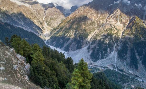 istock Snow capped high mountains alpine meadows and local mountain settlements 1159778099
