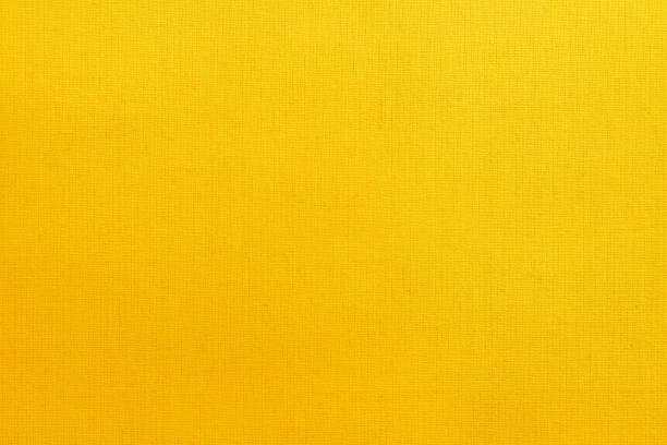 istock Yellow cotton fabric texture background, seamless pattern of natural textile. 1159778132