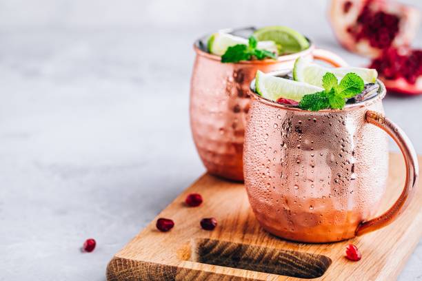 istock Iced Cold Moscow Mule cocktail with lime and pomegranate 1159779143