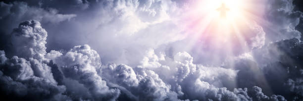 Jesus Christ In The Clouds Jesus Christ In The Clouds With Brilliant Light - Ascension / End Of Time Concept jesus christ stock pictures, royalty-free photos & images