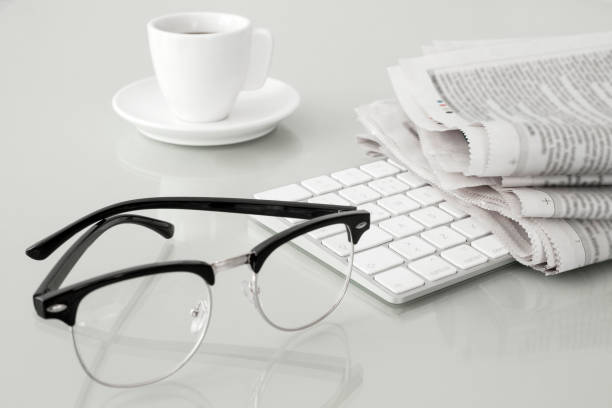 istock newspaper and coffee over office desk 1159779265