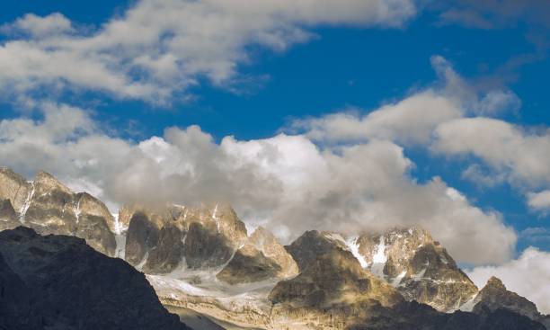 istock Snow capped high mountains alpine meadows and local mountain settlements 1159779867