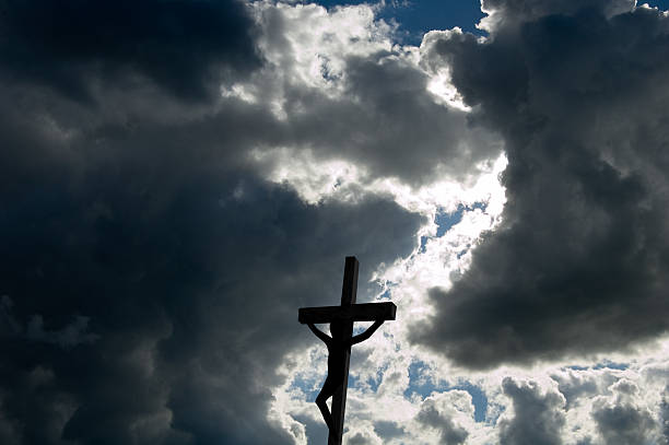istock Dark Day with  the Crucifix under heavy clouds 115978077
