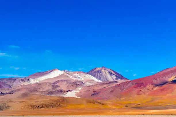 Photo of View of the beautiful mountain against the blue sky in Salvador Dali Desert Uyuni