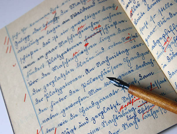 istock Old exercise book and pen with red edits 115978213