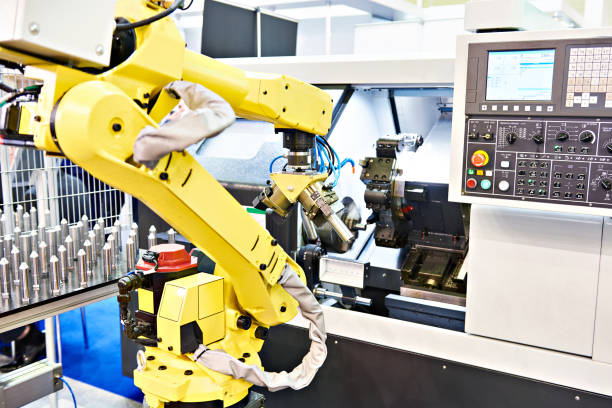 istock Robotic arm and cnc lathe 1159783005