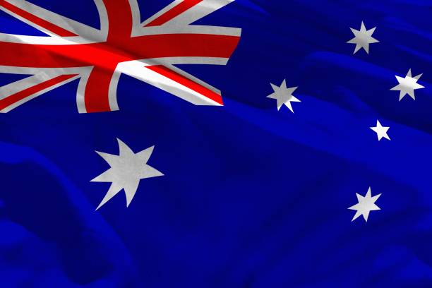 istock Waving Australia flag for using as texture or background, the flag is fluttering on the wind 1159784148
