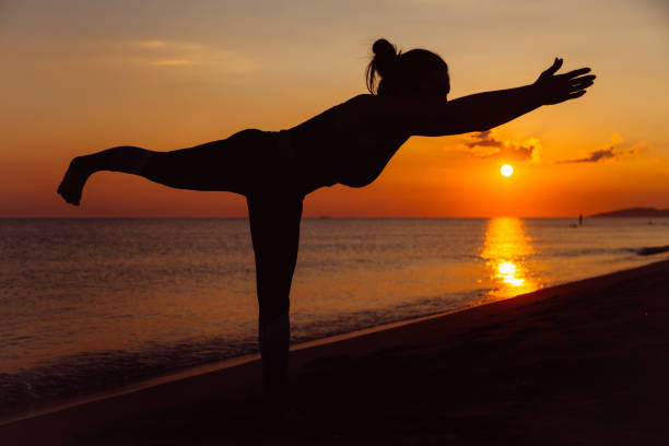 istock Woman doing yoga 1159785728