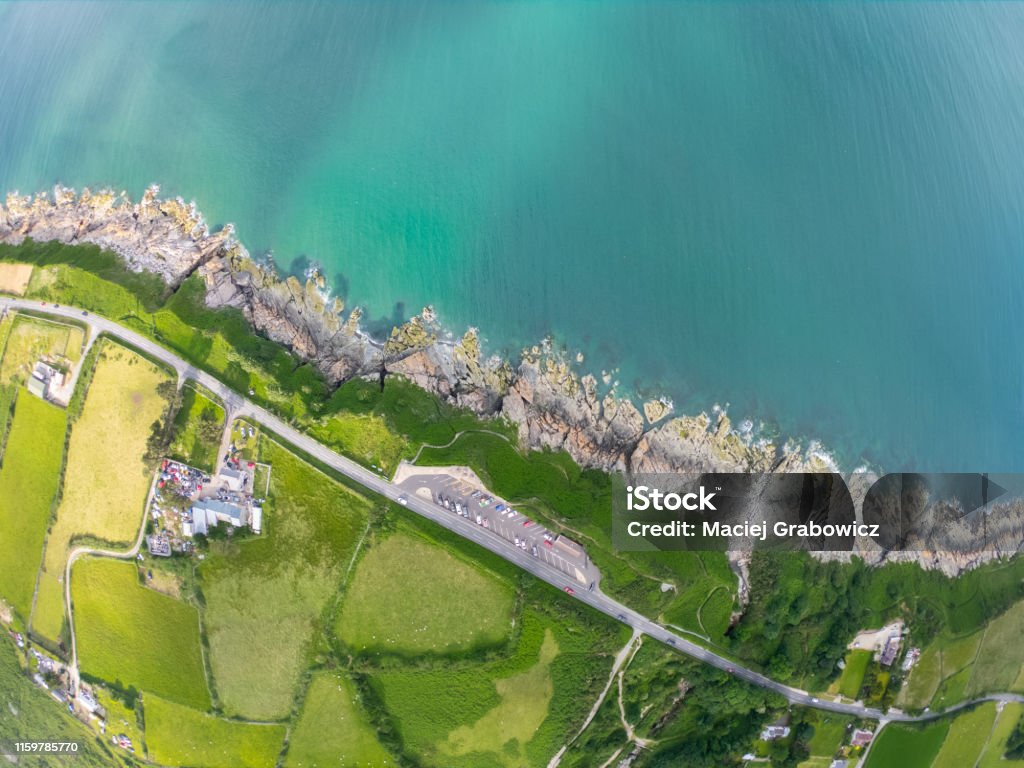 Top view on Coast of sea turquoise water and grassy fields, Irish sea in Newcastle Northern Ireland Newcastle - County Down Stock Photo