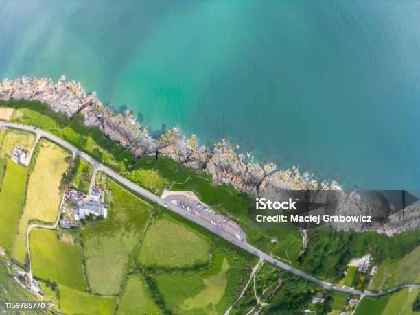 Top View On Coast Of Sea Turquoise Water And Grassy Fields Irish Sea In Newcastle Northern Ireland Stock Photo - Download Image Now