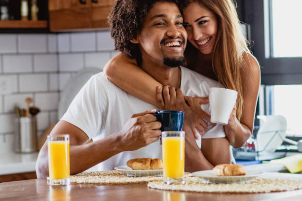 istock young couple is having breakfast in the morning in the kitchen 1159787955