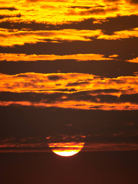 istock Sunset Shining Golden Light behind The Fluffy Clouds 1159790160