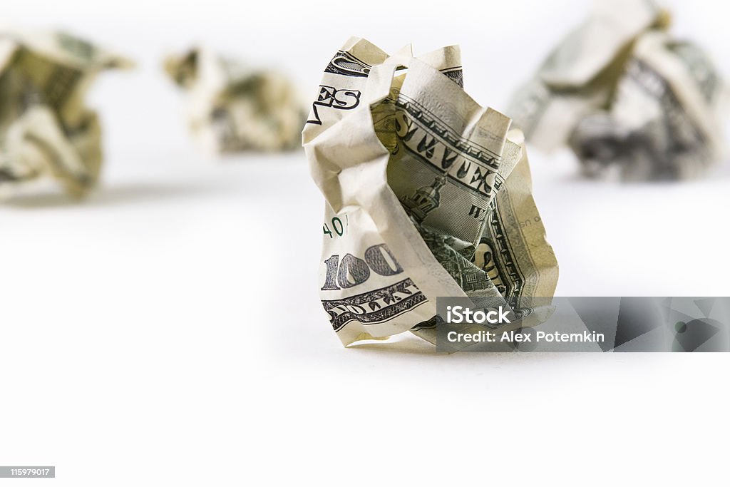 Economic depression World Wide Money: economic depression. Some US dollars wrinkly banknotes on white background. Currency Stock Photo