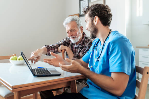 istock Male Caretaker Using Laptop while Explaining Prescription to Senior Man 1159791316