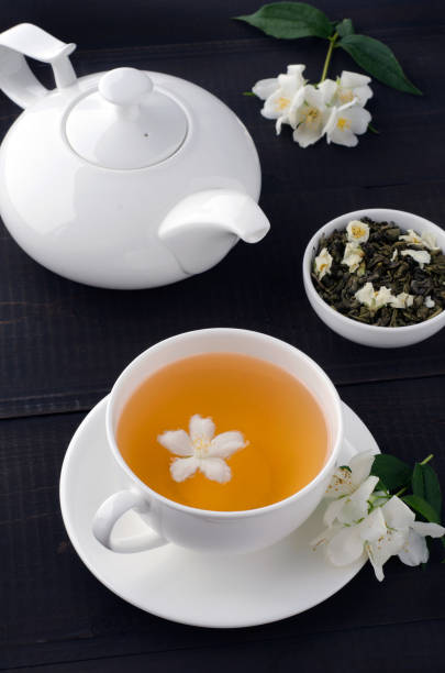 istock Green tea with jasmine in cup and teapot 1159792721
