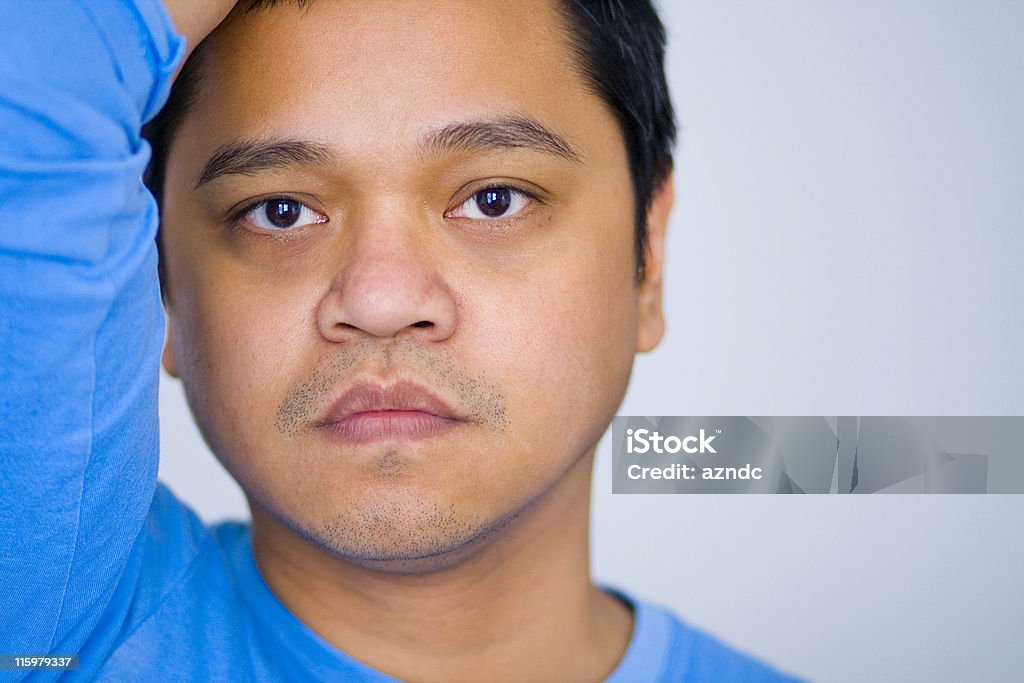 Overwhelmed Close-up of handsome Asian man with a worried look on his face. 30-39 Years Stock Photo