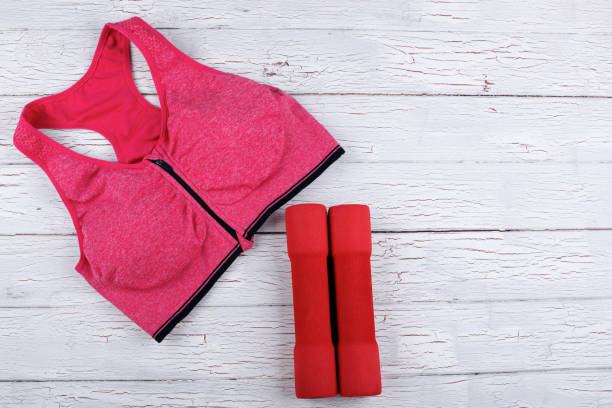 istock The bustier  and dumbbells stand on the floor 1159795951