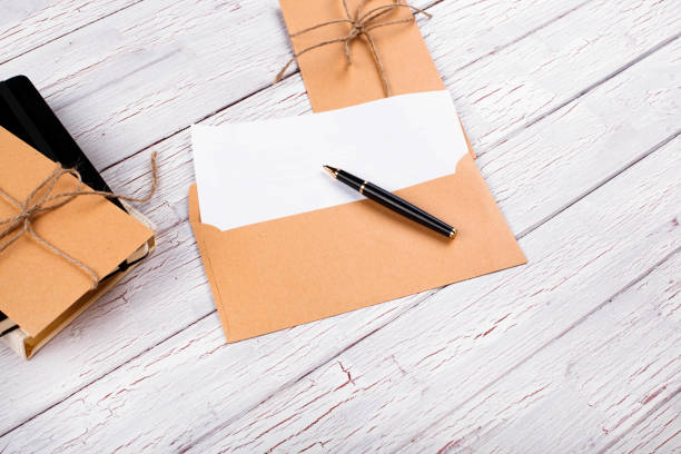istock The notebooks,envelope and pen stand on the table 1159796010