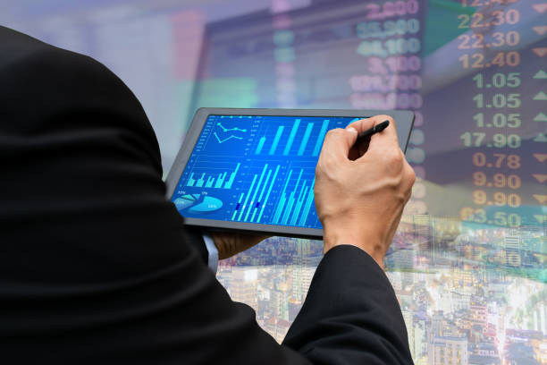 istock Technology business touch screen tablet stock market graph viewing