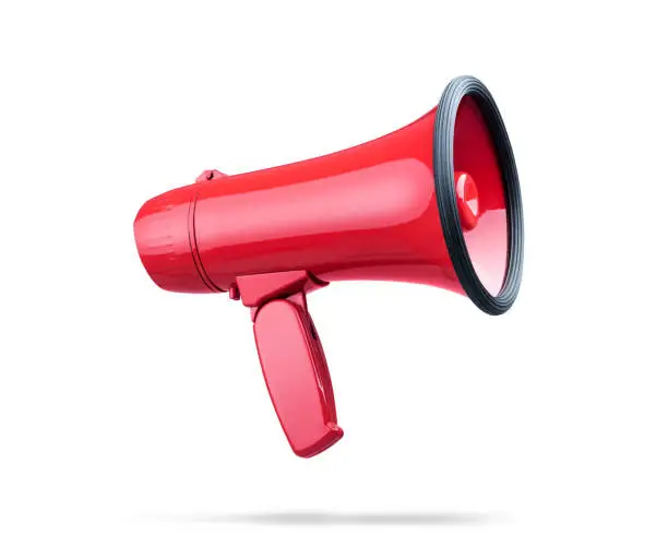 Photo of Beautiful red megaphone, isolated on white background. File contains a path to isolation