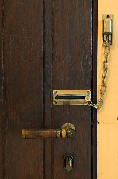 istock Door with safety lock - pega ladrao 115979755