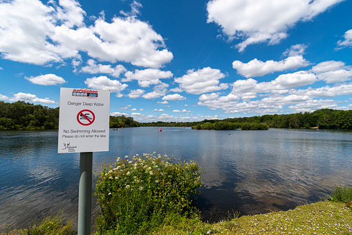 Sandhurst, United Kingdom - June 22 2019:   A council sign prohibiting swimming in Horseshoe Lake off Mill lane