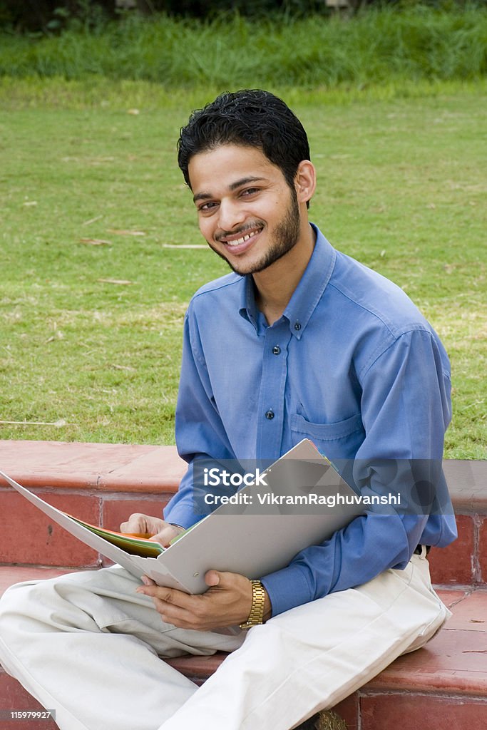 One Indian Student Office Worker Businessman with file Vertical Outdoor Indian Student/Businessman with a file in Hand Business Stock Photo