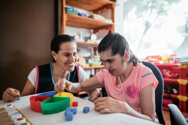 istock Working in nursery with children with Down Syndrome 1159799461