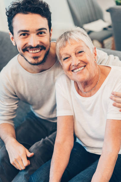istock Happy senior woman and her son 1159801010