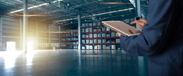istock Businessman manager using tablet check and control for workers with Modern Trade warehouse logistics. Industry 5.0 concept 1159801440