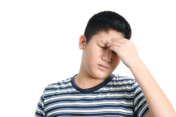istock Asian preteen boy having headace on white background. 1159802753