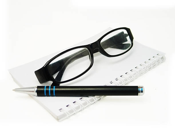 istock Glasses & Pen on calendar isolated - Clipping path 115980518