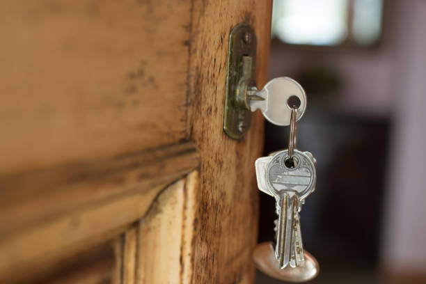 istock lock with keys in the old or retro door, vintage 1159807295