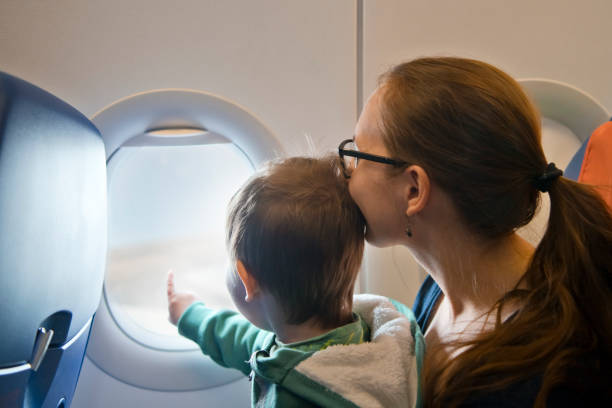 istock Family travelling by plane 1159810688