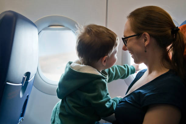 istock Family travelling by plane 1159810689
